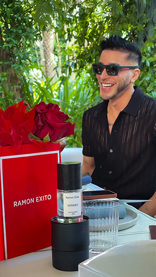 Ramon Natcher smiling with Dinero perfume